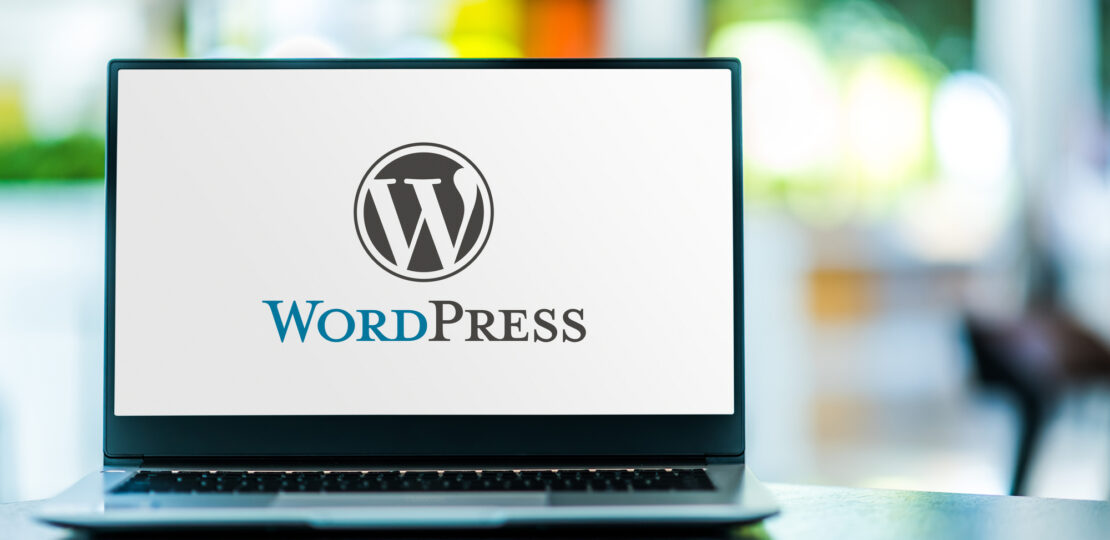 Laptop computer displaying logo of WordPress